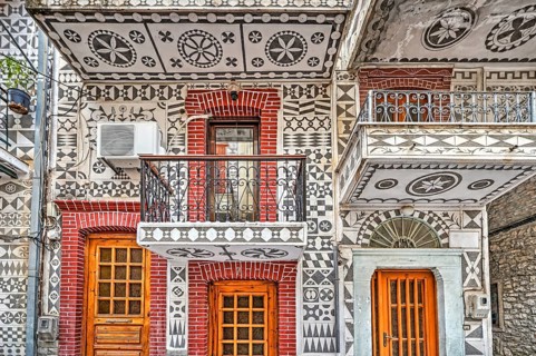 Traditional houses decorated with the famous geometric scratch patterns in the medieval mastic