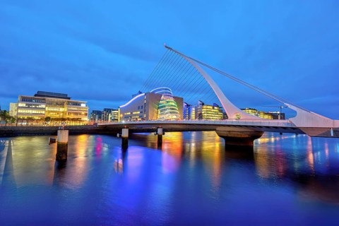 The River Liffey with the Samuel Beckett Bridge in Dublin, Ireland, at dusk, Europe