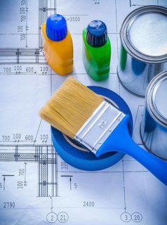 Construction plan with paint brush metal cans plastic bottles and adhesive duct tape maintenance