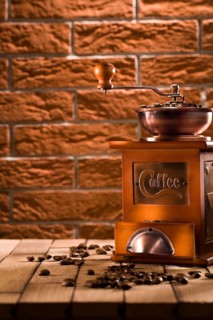 Wooden coffee grinder on table