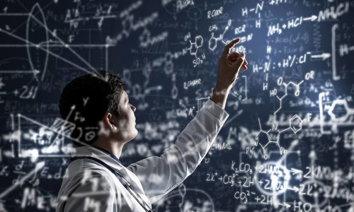Young scientist works with scientific formulas. mixed media