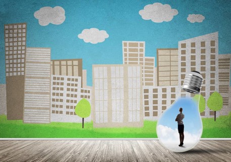 Businesswoman inside light bulb against city drawn concept
