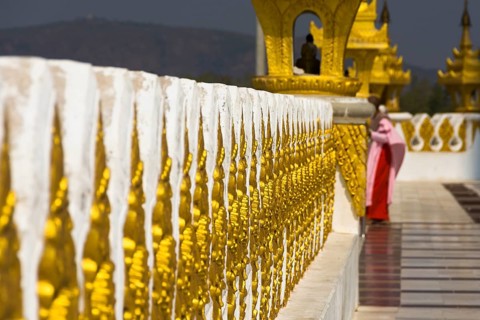 Nun on a gilded pagoda, Myanmar, Burma, Southeast Asia, Asia