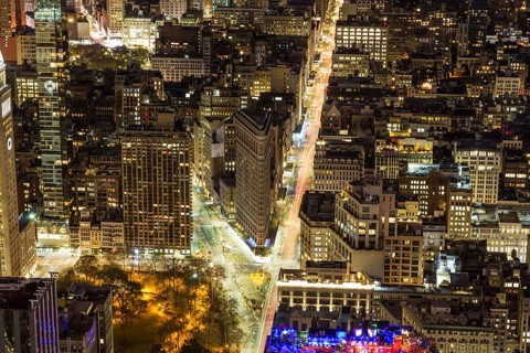 Cityscape of Manhattan with Flatiron Building at Night. New York City, United States of America.
