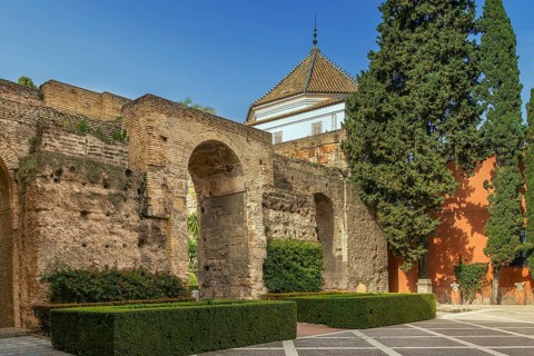 Courtyard at the entrance to Alcazar of Seville with wall from XI century, Spain, Europe