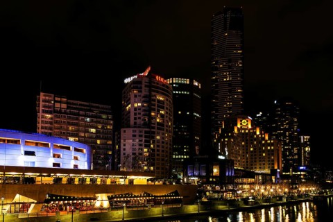 Central melbourne city river side modern urban skyline at night in australia