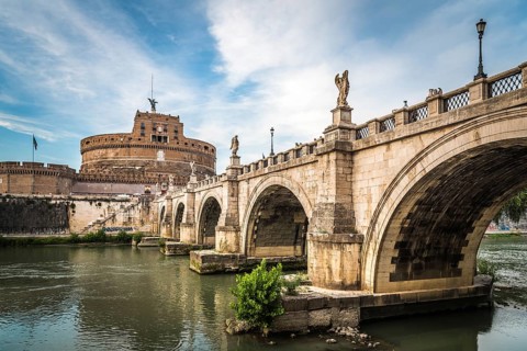 Rome, Italy, August 18, 2016: Bridge and Mausoleum Castel Sant Angelo at sunset. The Mausoleum of