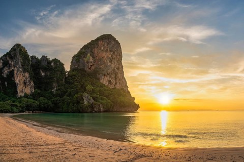 Tropical islands sunset view with ocean sea water and sand beach at Railay Beach, Krabi Thailand