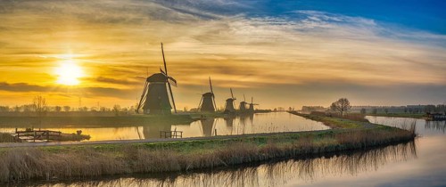 Rotterdam Netherlands, sunrise panorama nature landscape of Dutch Windmill at Kinderdijk Village