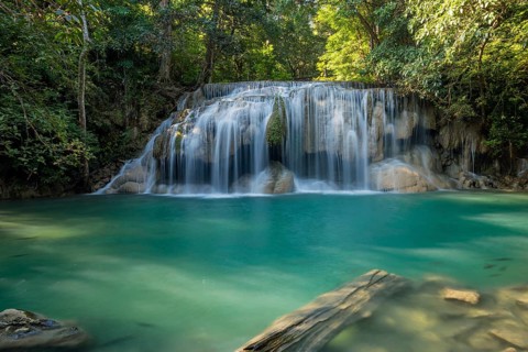 Erawan Waterfall with fish in water in Kanchanaburi Province, Thailand, Asia