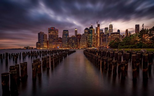 The Manhattan skyline as seen from Brooklyn at night. New York, USA, North America