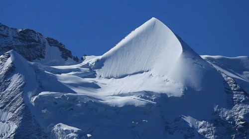 Snow covered pointed peak of Mount Silberhorn, Switzerland, Europe