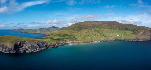 Landscape view of the turquoise waters and golden sand beach at Slea Head on the Dingle Peninsula