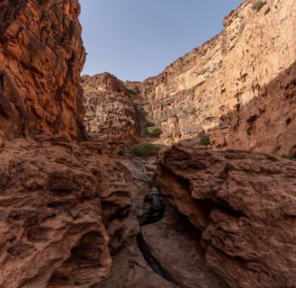 Hiking through the iconic Amtoudi canyon in the Anti-Atlas, Morocco, Africa