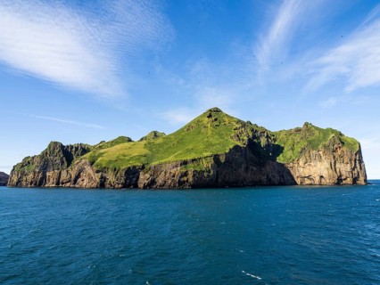 Steep cliffs in the blue sea, Westman Islands, Iceland, Europe