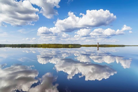 Landscape with a symmetrical reflection on the Vyg river (part of the White Sea-Baltic Canal),