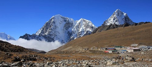 Huts in Lobuche and snow covered mountains Tobuche, Taboche and Cholatse, Nepal, Asia