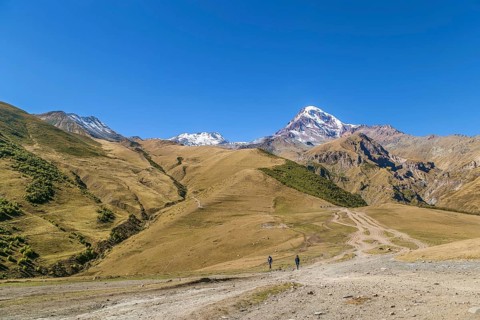 View of Mount Kazbek from Gergeti Trinity Church in autumn, Georgia, Asia