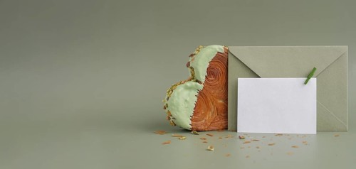 White empty mock up template paper note card Delicious fresh croissant topped with Matcha Green Tea