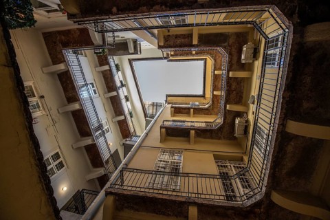 View upwards, inner courtyard of a block of houses. Typical of this type of building in the
