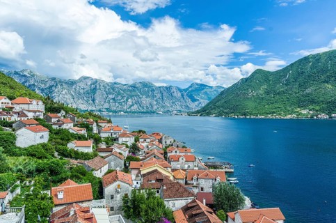Top aerial panoramic view on old town Perast and Kotor bay on summer day in Montenegro