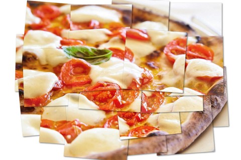 Creative picture of Pizza Margherita with Mozzarella cheese, basil and tomatoes