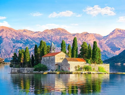 Island of Saint George among the mountains of Perast, Montenegro, Europe