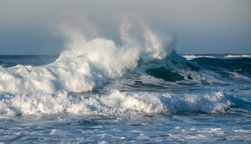 Dangerous wavy ocean with wind waves crashing during tropical storm
