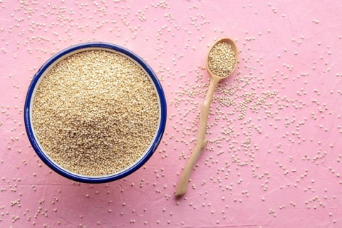 Quinoa in a bowl, healthy organic wood, uncooked, shot from above with copy space, Food