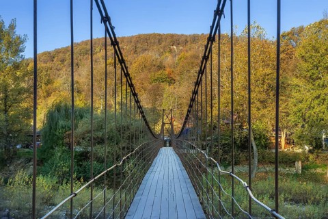 Suspension pedestrian bridge across the river Belaya, Kamennomostsky, Russia, Europe