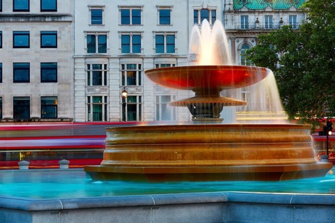 London Trafalgar Square fountain at sunset England