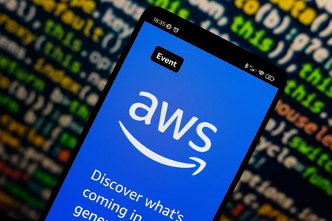 In this photo illustration, the Amazon Web Services (AWS) logo is displayed on the website on the
