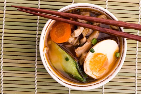 Ramen egg noodle soup dish with salmon fish