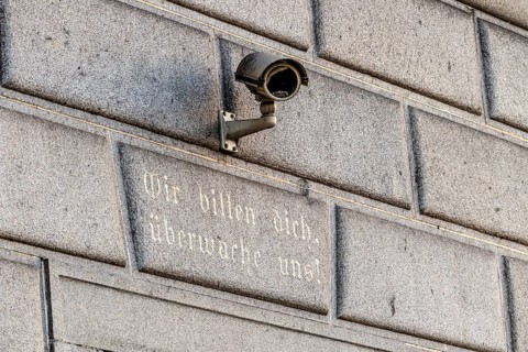 Surveillance camera on a building, symbol for surveillance, internal security, control, data