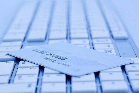 Close-up of a credit card for cashless payment and keyboard. Symbol photo for shopping on the