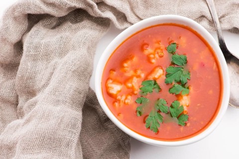 Tomato soup with rice decorated with parsley