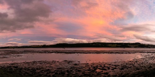 A panorama view of the Clyde River near Dumbarton at low tide at sunset