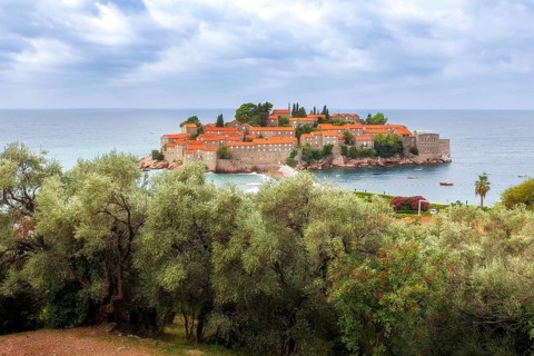 Sveti Stefan island in Montenegro resort at Adriatic sea, high angle view. Famous travel