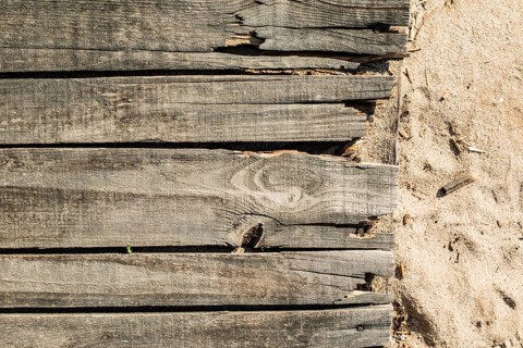 Wood boards on the beach. Old vintage woods