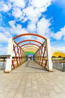 Magnificent light bridge over the river Aviles. The picturesque town of Avilas in Asturias. North