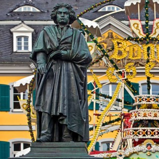 The Beethoven monument in front of the Bonn Christmas market Ferris wheel on Münsterplatz, Bonn,