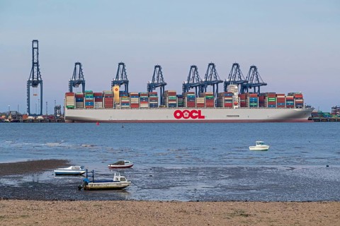 Container ship, container gantry cranes, boats, harbour, Harwich, Suffolk, England, Great Britain
