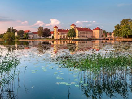 Rheinsberg Castle on Lake Lake Grienerick in the last evening light, Rheinsberg, Brandenburg,