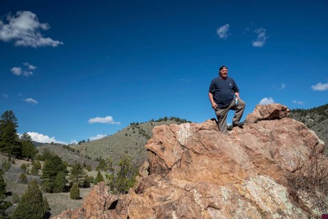Idledale, Colorado - A hiker stands at a high point on the Bruin Bluff Trail in Lair o' the Bear