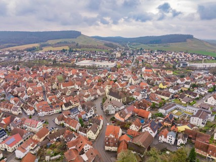 Aerial view of a village with red roofs and hills in a rural setting, Großbottwar, Ludwigsburg