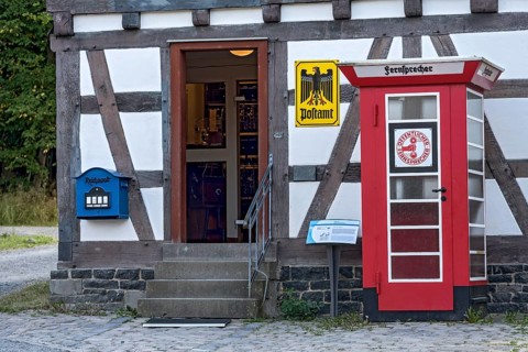 Telephone box, public telephone, historical post office, post office, house from Ahlbach,