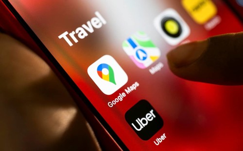 In this photo Illustration a person browsing taps Google maps application on a tablet device on 24