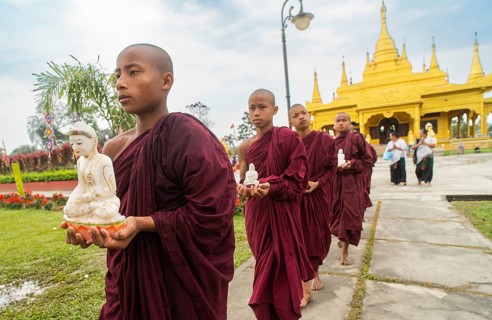 NAMSAI, INDIA.- APRIL 16: Buddhist monks carries the idol of Lord Buddha as they celebrate the