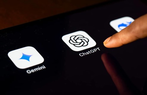 In this photo Illustration a person taps ChatGPT app icon on a tablet device on 24 May 2025 in New