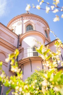 Close-up of a historic dome surrounded by blossoming flowers in spring, Mosque, Schwetzingen Palace